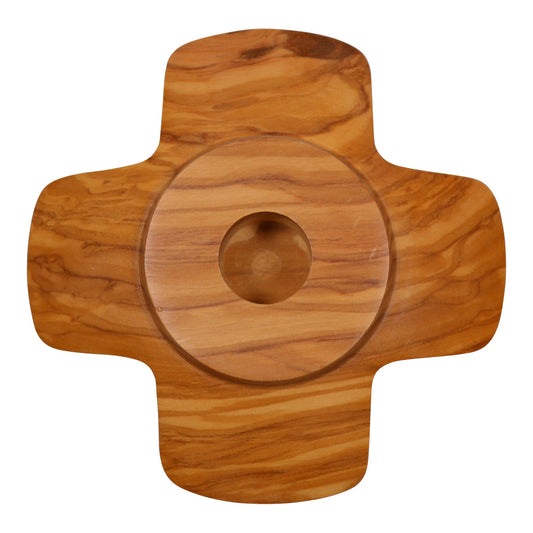 Top view of an olive wood candle holder with a cross-like shape, showing the circular central candle recess and the beautiful natural grain of the wood.