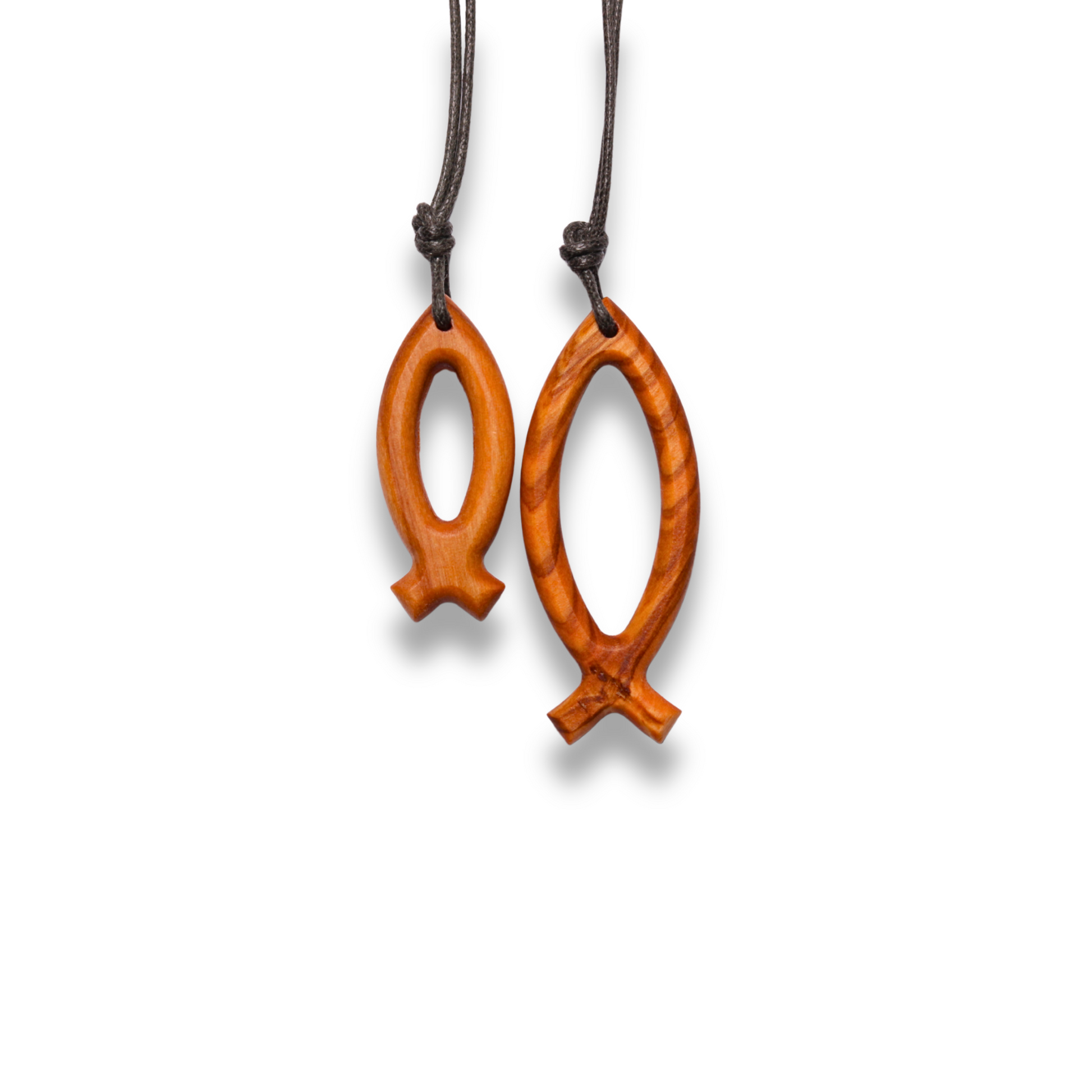 Two wooden fish-shaped pendants on brown cords against a white background
