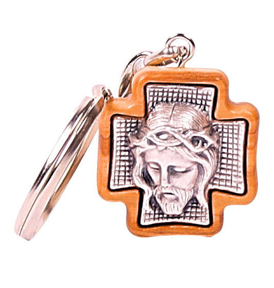 Olive wood pendant with a detailed silver-tone metal depiction of Jesus' face, set seamlessly within the carved wood frame, attached to a silver-toned metal chain.