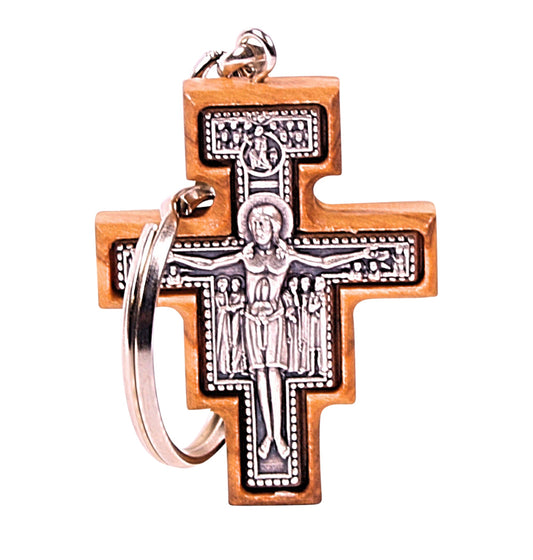 Olive wood San Damiano cross keychain pendant with a detailed metal engraving of Christ.