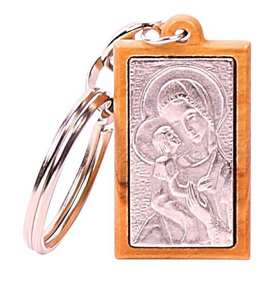 Olive wood keychain featuring a silver-toned metal embossed image of the Virgin Mary holding baby Jesus, hand-made in Nazareth.
