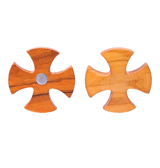 Two olive wood magnets in the style of a cross pattée are displayed against a white background. Both feature the distinct wide-flared arm design and smooth, polished surfaces highlighting the wood's natural grain.