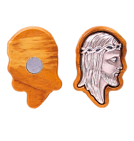 Olive wood magnet featuring two views: one side displays the magnet's back with a simple, polished wood surface and a central circular magnet, while the other side shows a detailed silver-toned metal relief of Jesus' profile with a crown of thorns, set within a perfectly contoured olive wood frame.