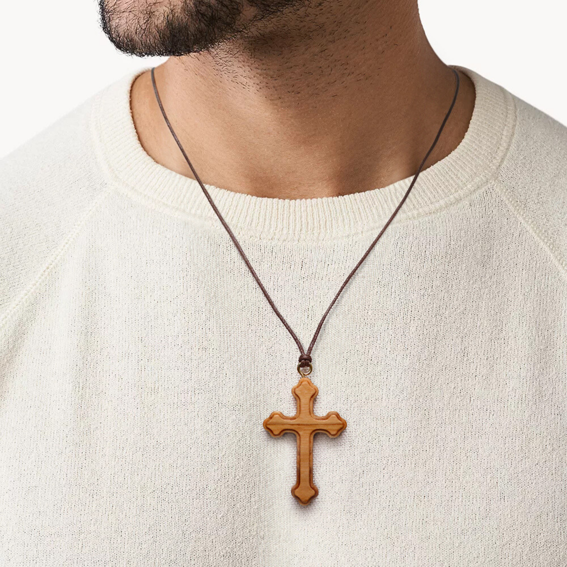 Man wearing Orthodox olive wood cross necklace