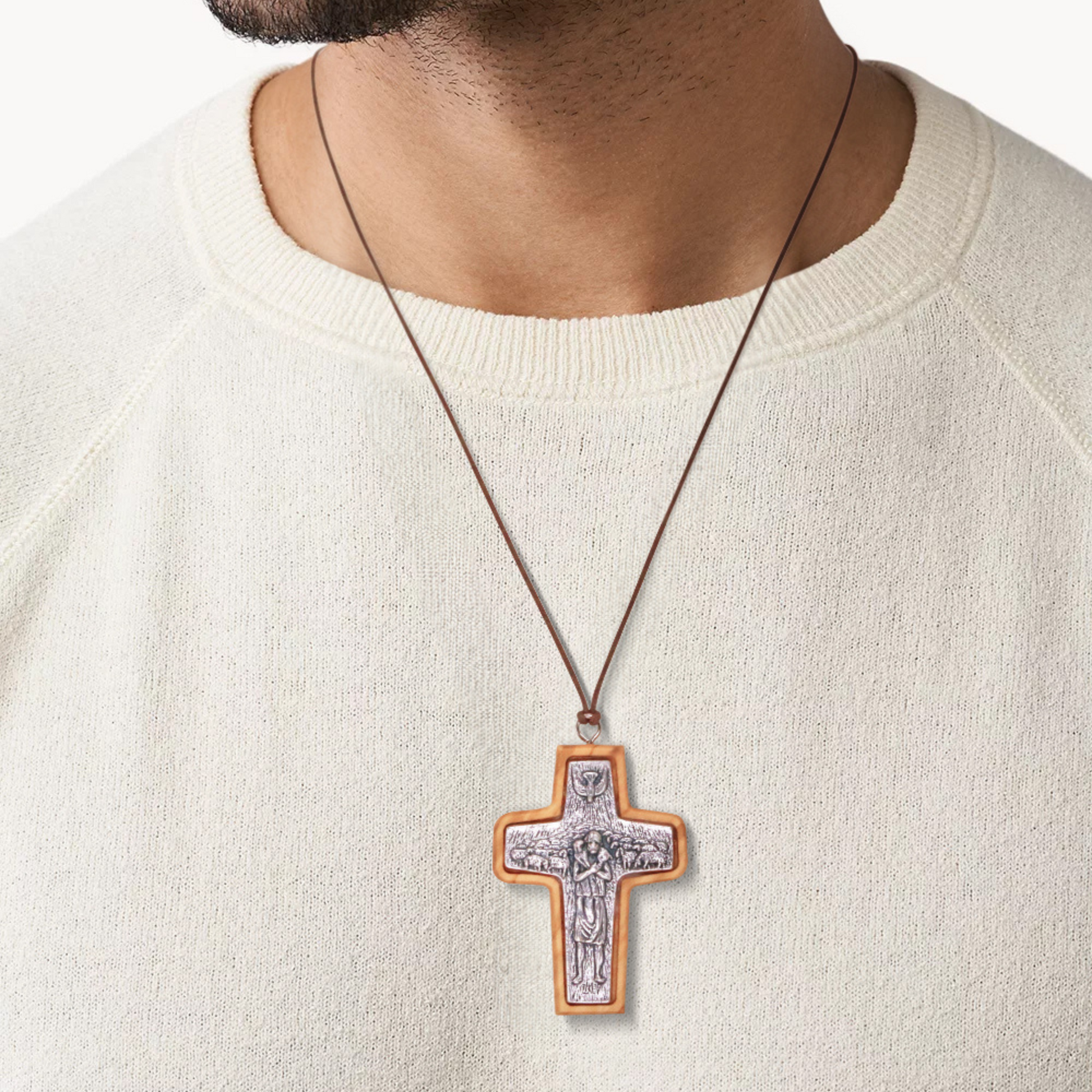 Man wearing Pope Francis Olive Wood Framed Metal Cross