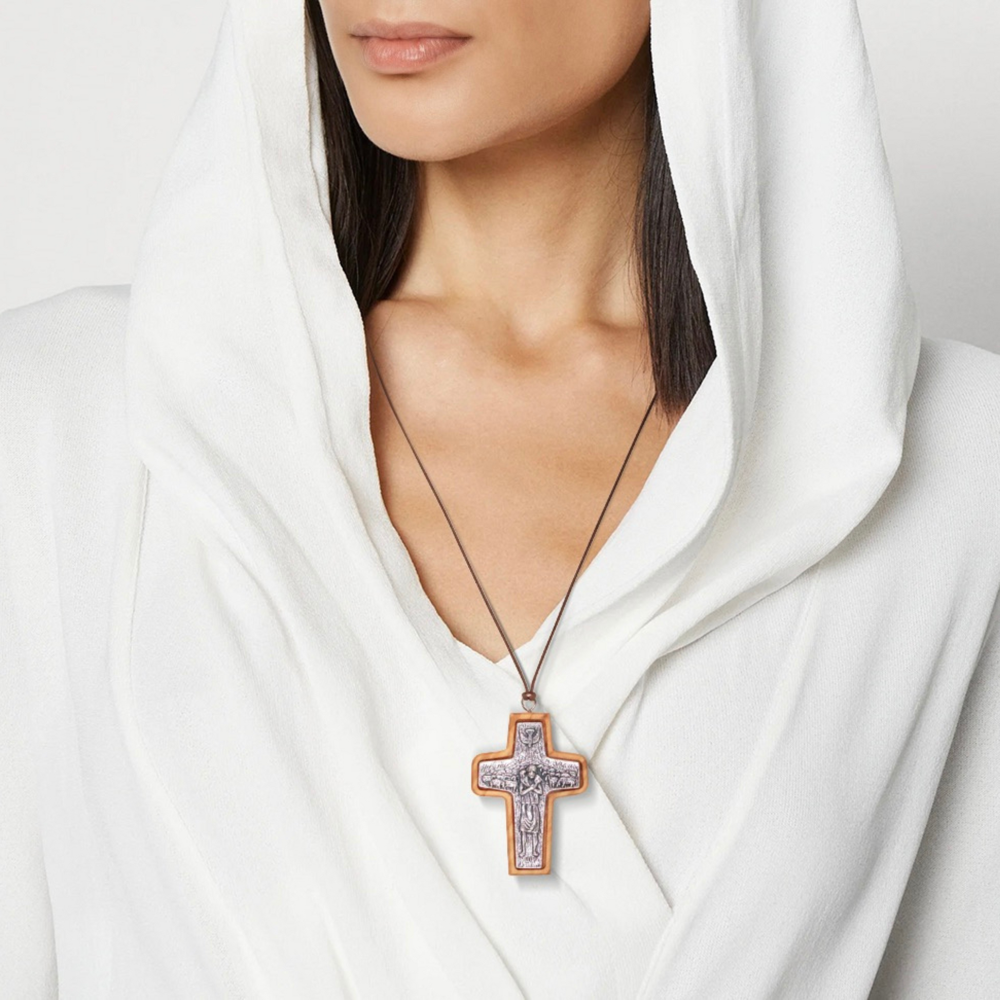 Woman wearing Pope Francis Olive Wood Framed Metal Cross