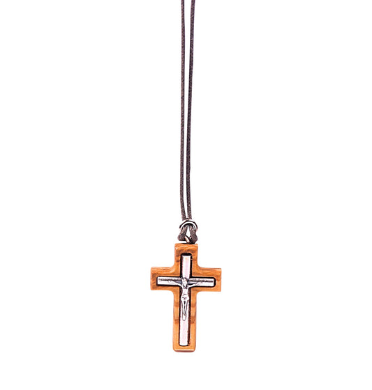 A minimalistic olive wood crucifix pendant with a perfectly embedded silver-toned metal depiction of Jesus, hanging from a soft cotton cord.