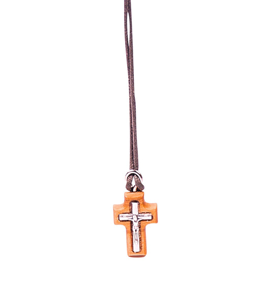 Olive wood crucifix pendant with a silver-toned metal depiction of Jesus, hanging from a soft cotton cord.