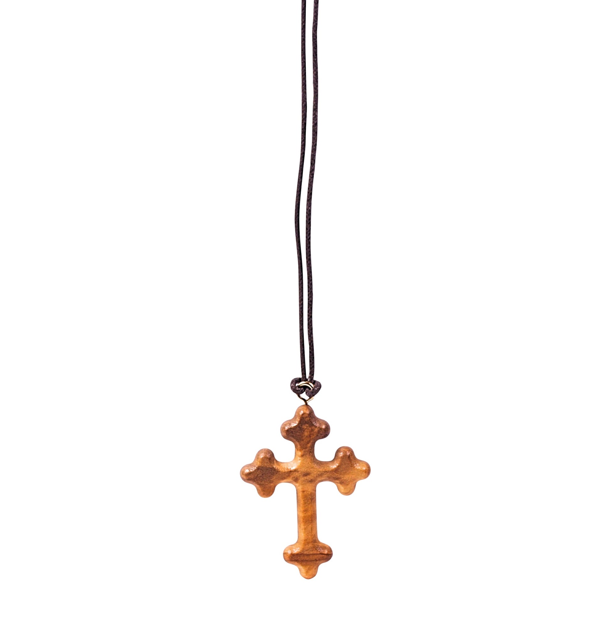 Olive wood orthodox cross pendant with three rounded protrusions on each arm, suspended from a soft cotton cord.