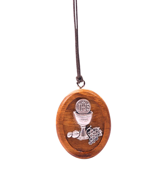 Olive wood pendant featuring a silver-toned metal emblem of a chalice with bread inscribed 'IHS', accompanied by grapes and additional bread, all hanging from a soft cotton cord.