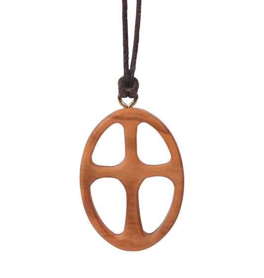 This pendant is a beautifully carved representation of a cross, made from olive wood. The cross is enclosed within an oval shape, with the arms of the cross extending out, touching the oval's perimeter.