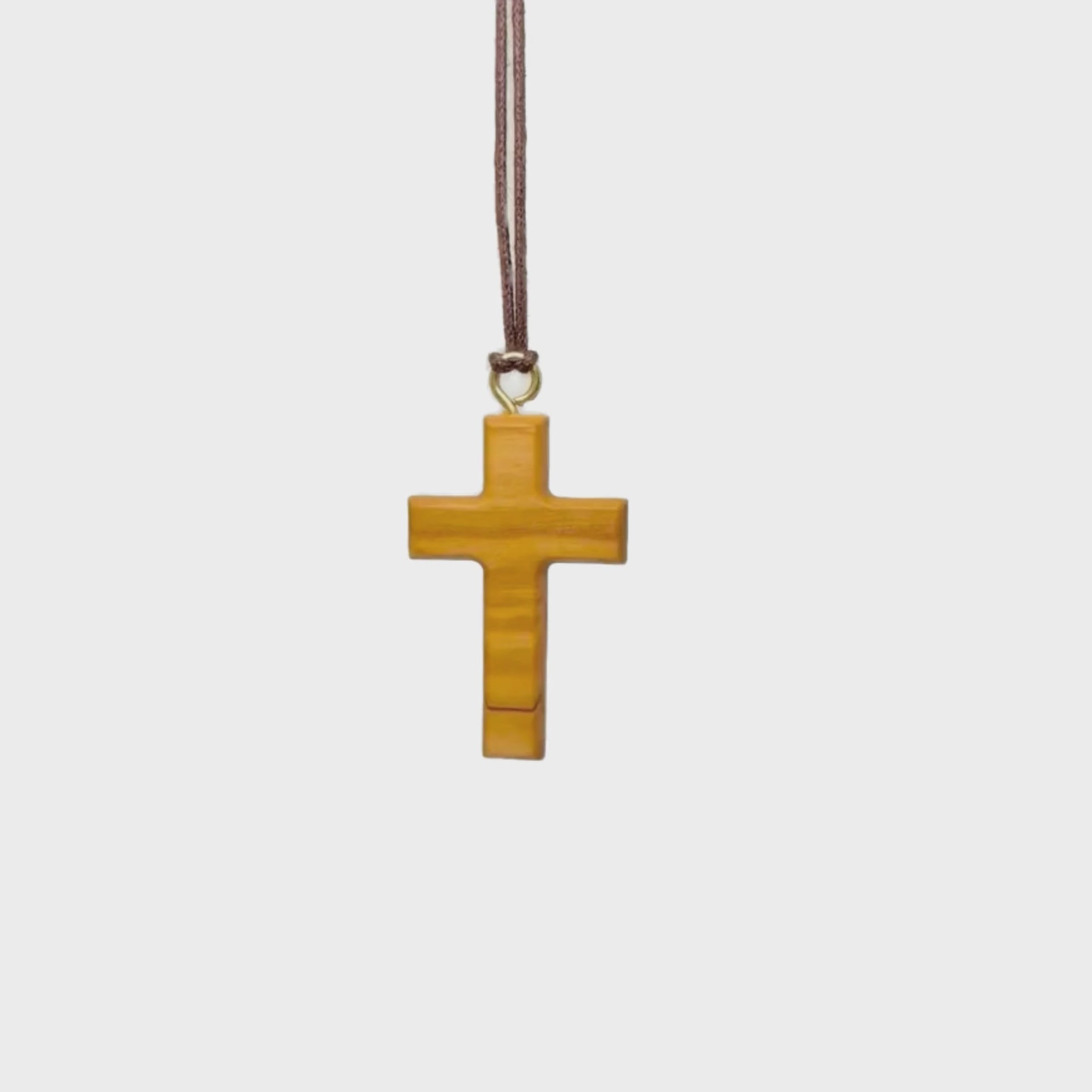 Minimalist olive wood cross video rotating