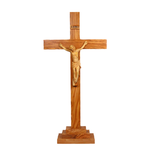 The Altar Olive Wood Crucifix, handcrafted in Nazareth, stands as a testament to faith and artistry. Made from intricately grained olive wood, it measures 44 cm tall, 23.5 cm wide, and 2 cm thick