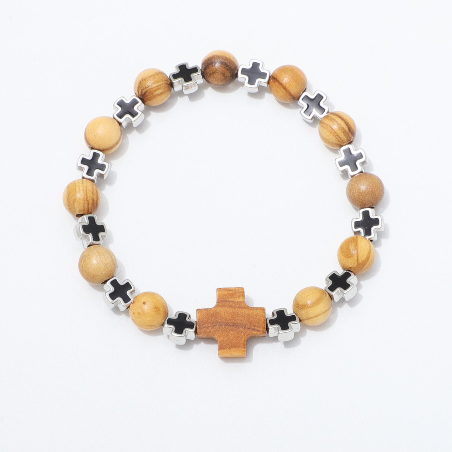 A beaded stretch bracelet featuring light brown wooden beads, silver-toned cross charms, and a larger central wooden cross, displayed on a clean white background.