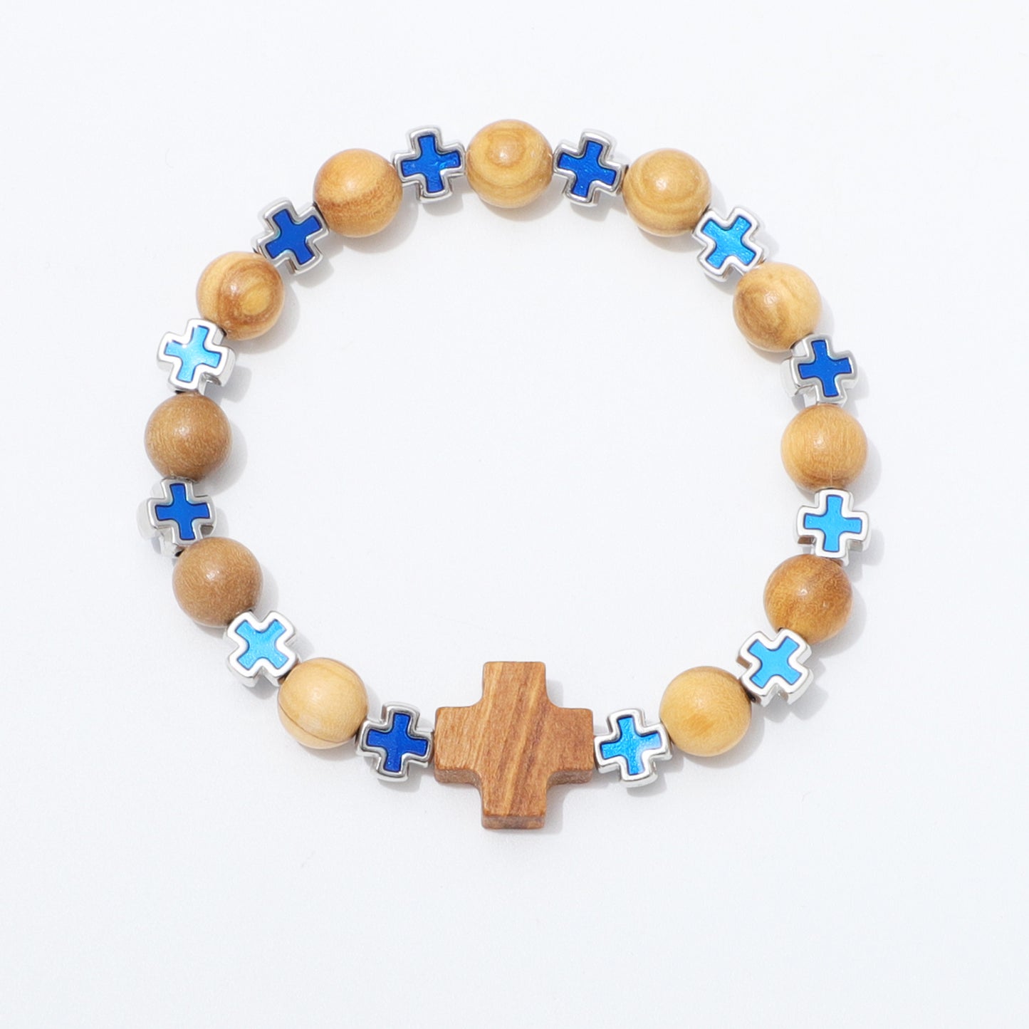 A beaded stretch bracelet featuring natural wood beads, a central wooden cross, and alternating blue and light blue enamel cross charms set in silver-tone metal, displayed on a clean white background.
