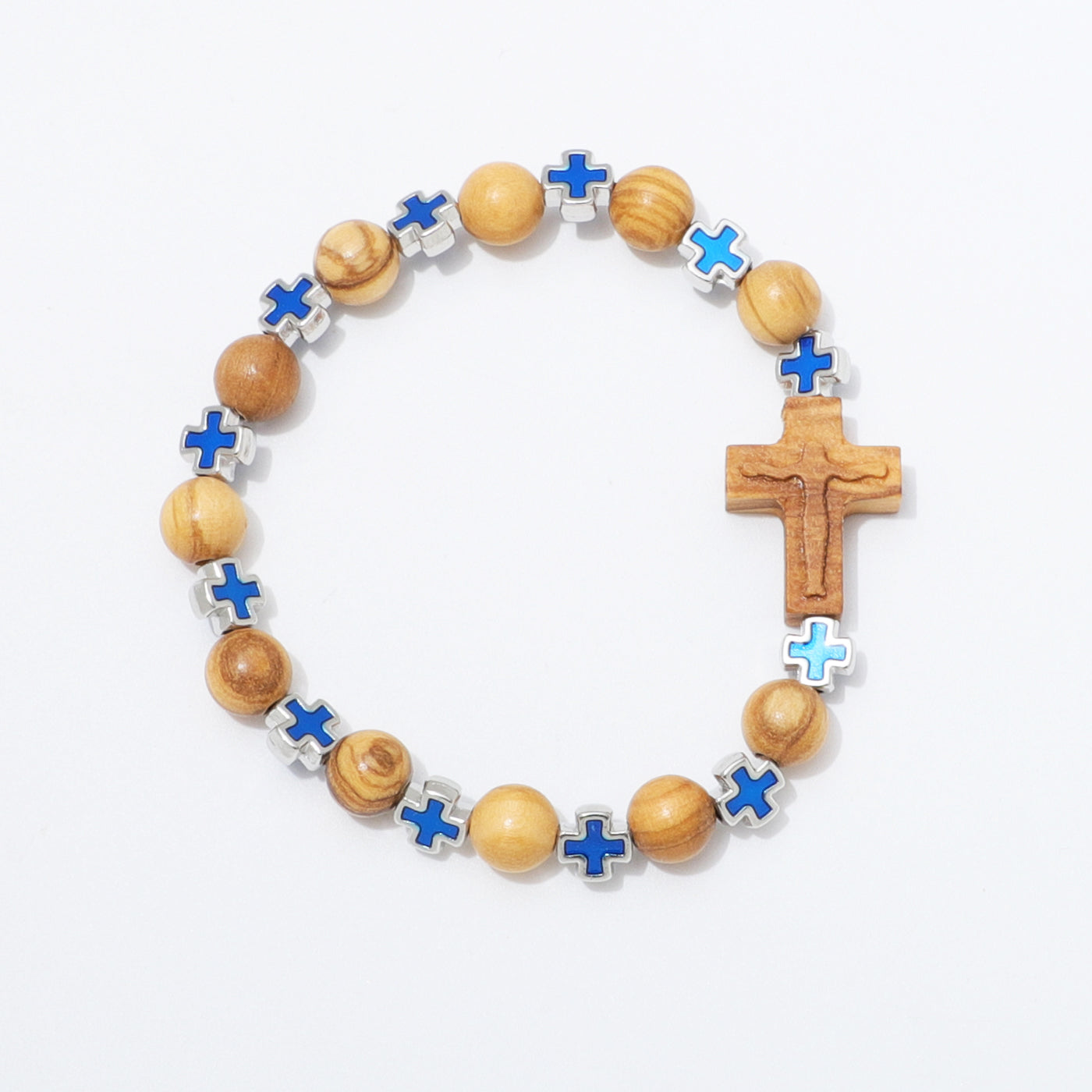 A beaded rosary-style bracelet with light brown wooden beads, small blue enamel crosses, and a larger wooden crucifix pendant, photographed on a clean white background.