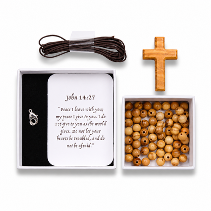 Set of wooden beads, necklace with clasp, and cross in a box with John 14:27 verse card.