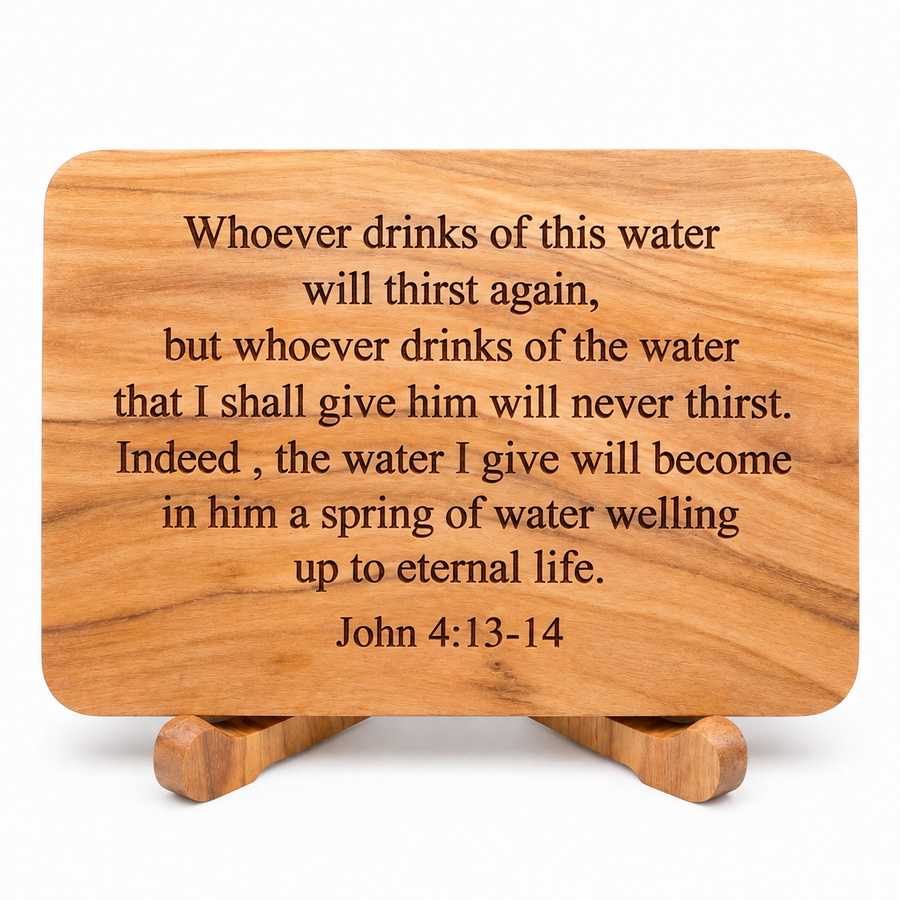 A rectangular wooden plaque with rounded corners and a small matching wooden stand, engraved with the John 4:13-14 Bible verse. The plaque is shown on a clean white background.