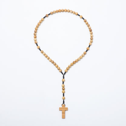 Olive wood rosary with a cross pendant on a white background