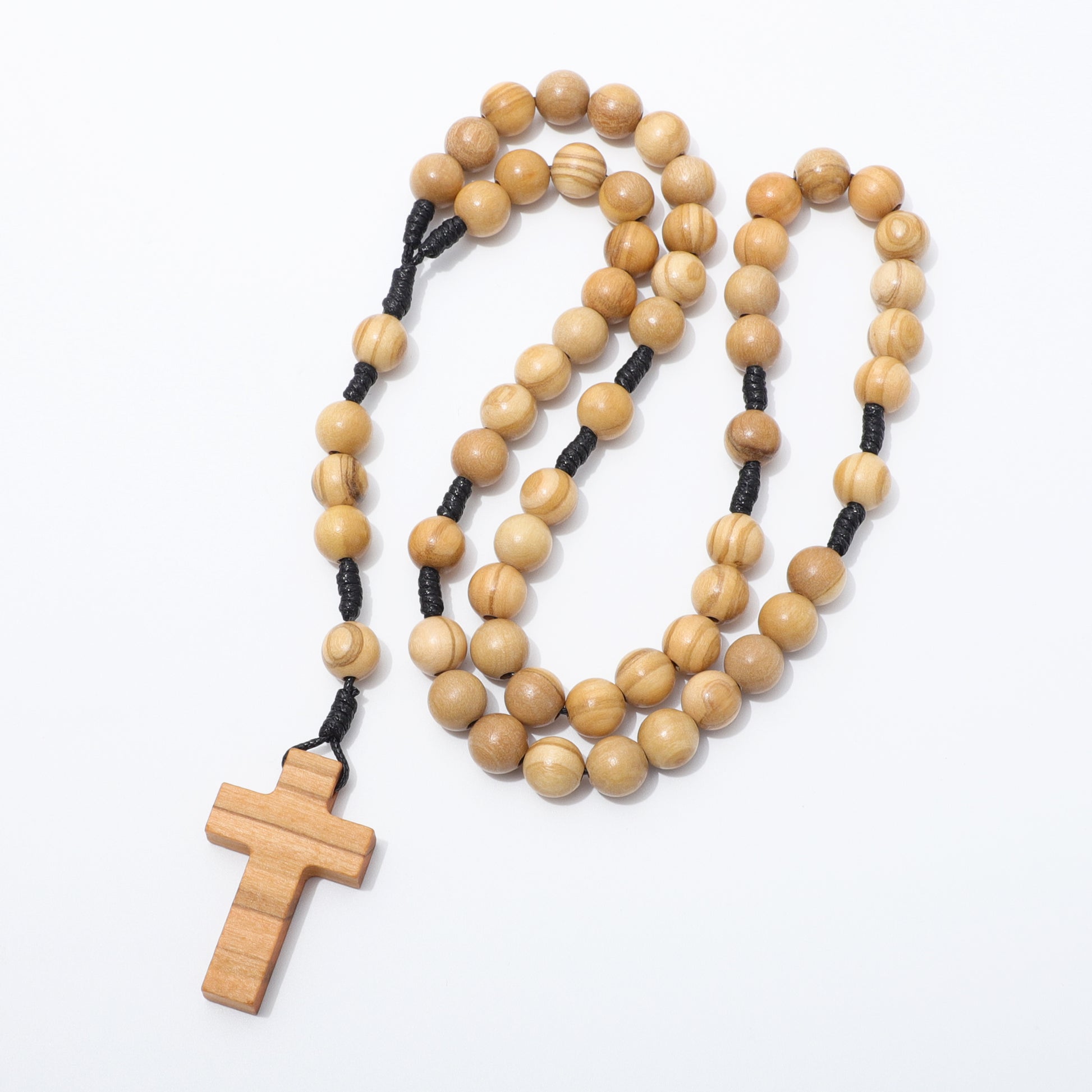 Olive wood rosary with a cross pendant on a white background