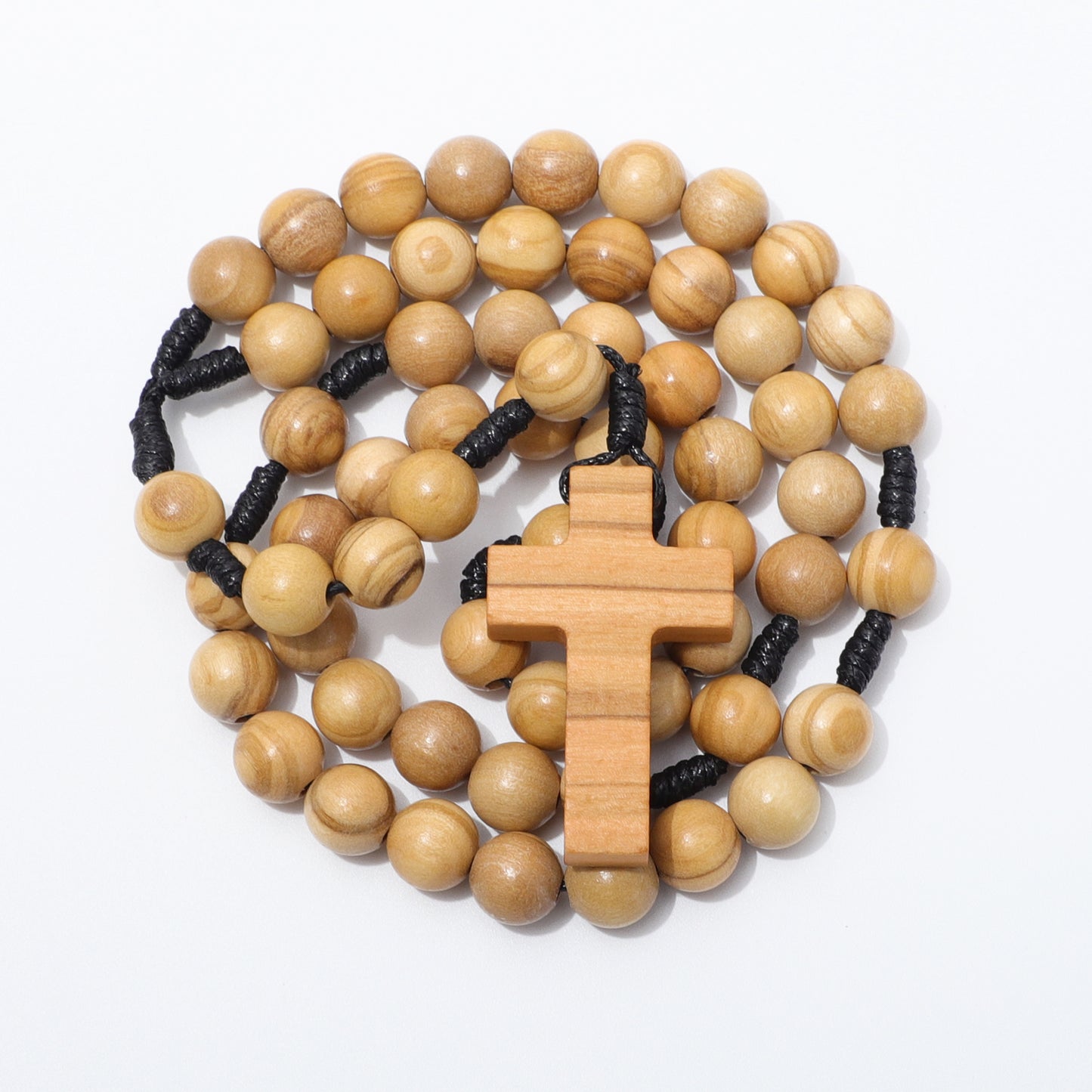 Olive wood rosary with a cross pendant on a white background