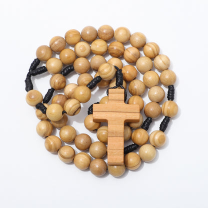 Olive wood rosary with a cross pendant on a white background