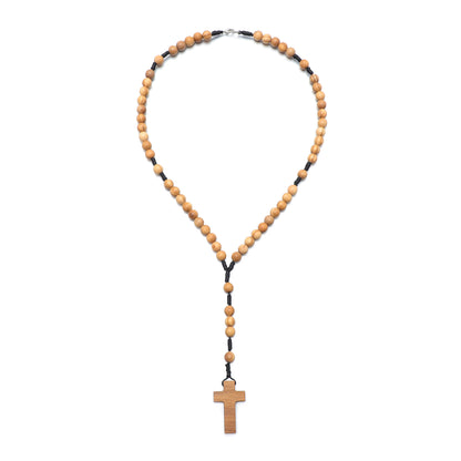 Wooden rosary necklace with a cross pendant on a white background