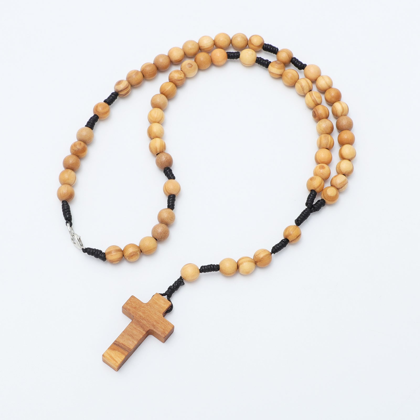Wooden rosary on a white background