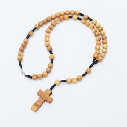 Wooden rosary on a white background