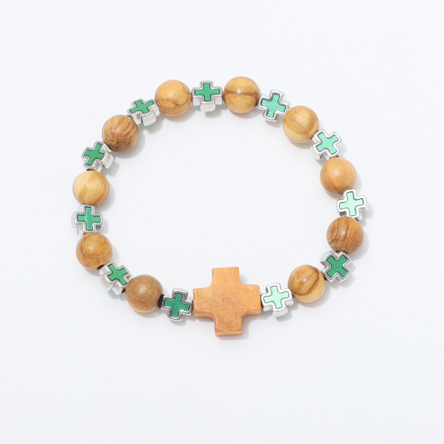 A beaded stretch bracelet featuring light brown wooden beads, small green cross charms with silver edges, and a larger central wooden cross, displayed on a clean white background.