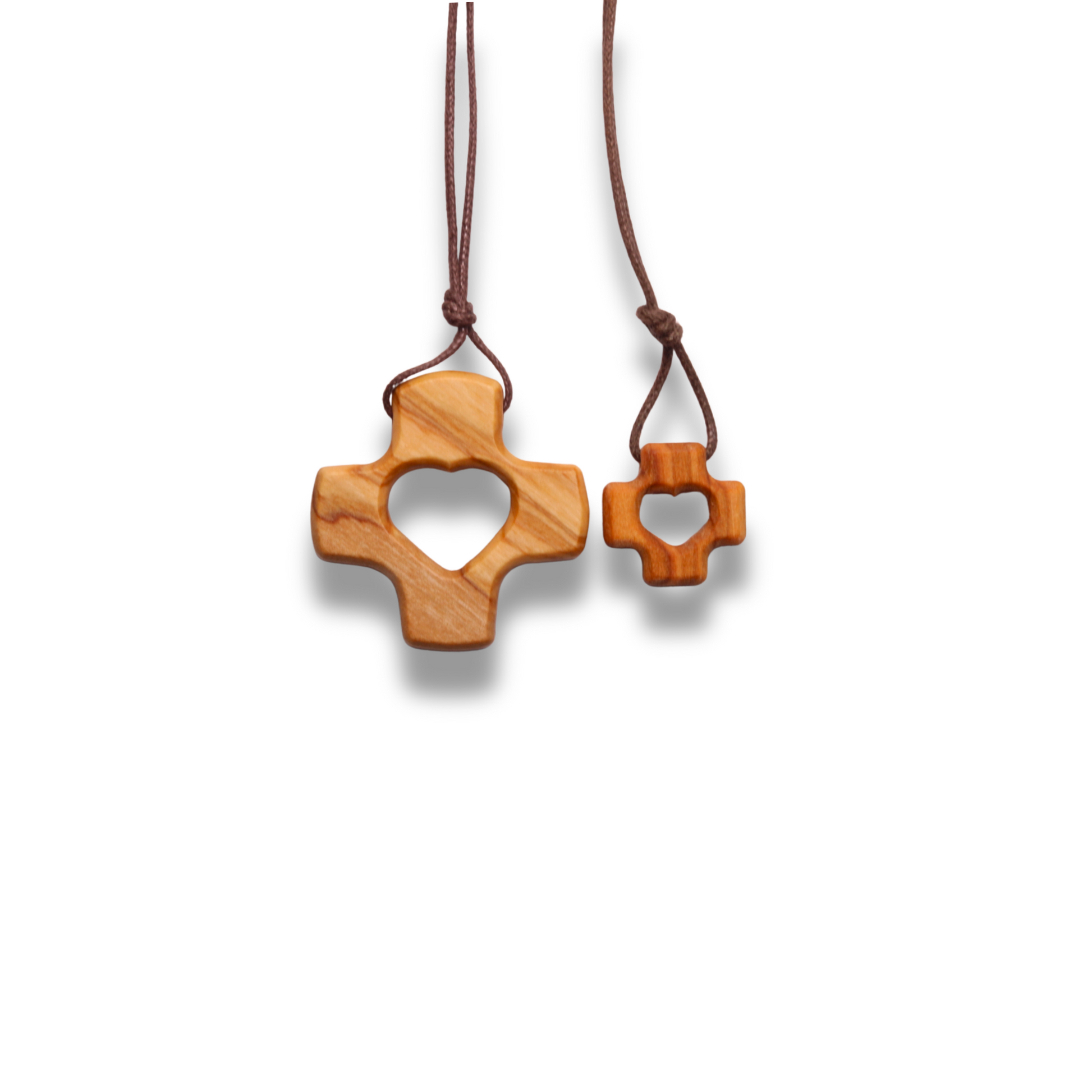 Wooden cross-shaped pendant on a white background