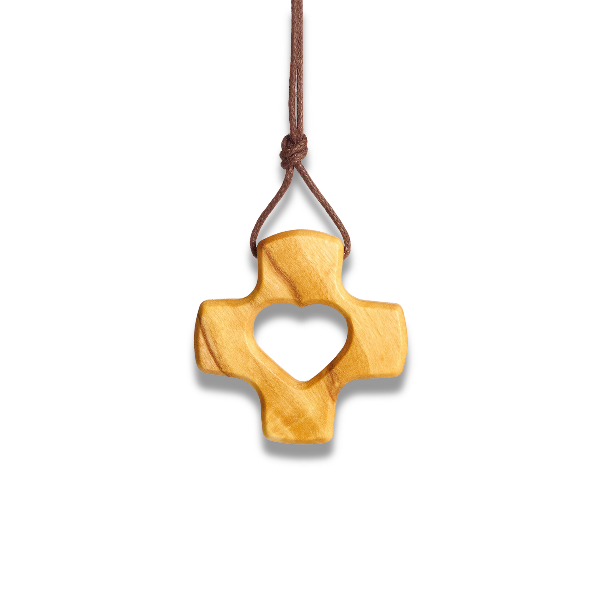 Wooden cross pendant with heart cutout on a white background
