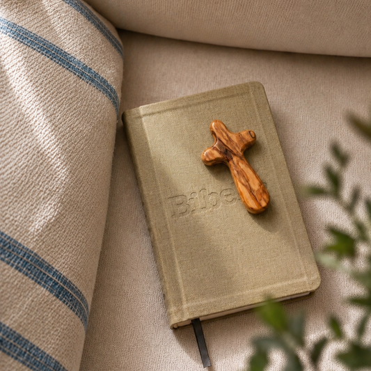 Olive Wood Holding Cross on a Bibel