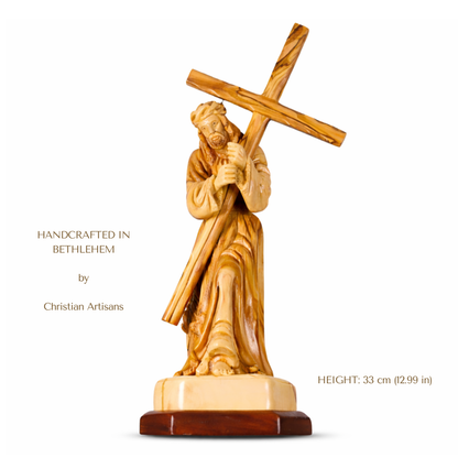 Wooden statue of JESUS carrying a cross, handcrafted in Bethlehem by Christian Artisans.