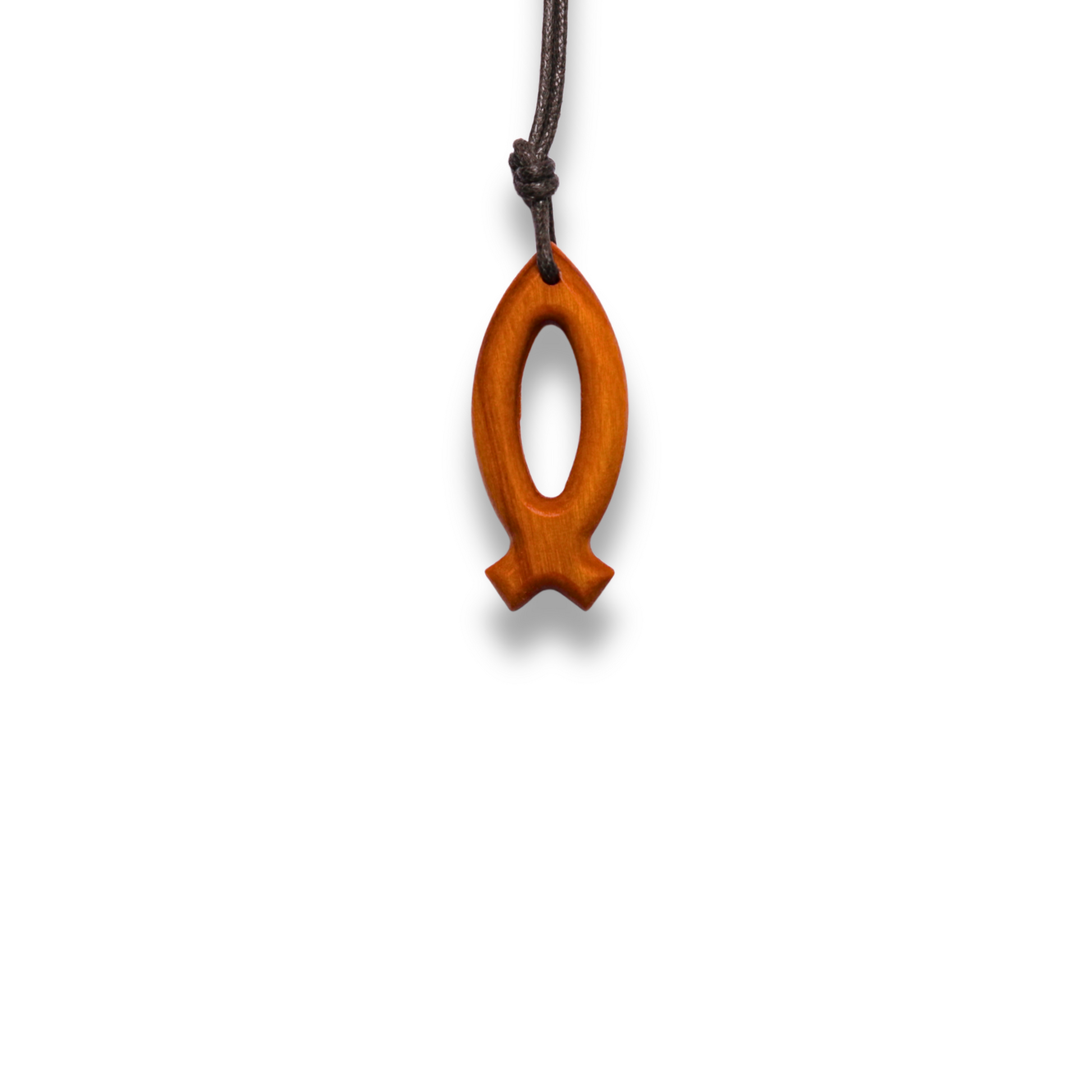 Wooden fish-shaped pendant on a white background