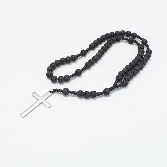 Lava stone prayer rosary arranged in loops on a white background