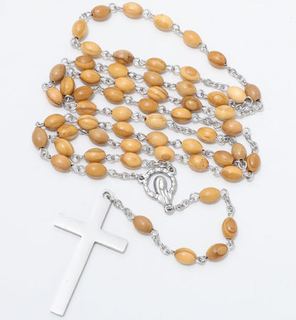A Catholic rosary featuring light brown wooden beads on silver-tone metal links, complete with a silver-tone crucifix and centerpiece, displayed on a clean white background.