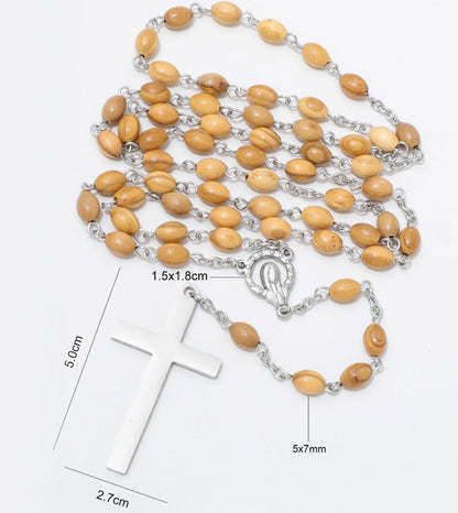 A rosary necklace with light brown wooden beads and a silver-tone cross pendant, shown on a white background with overlaid dimension labels for the cross and beads.