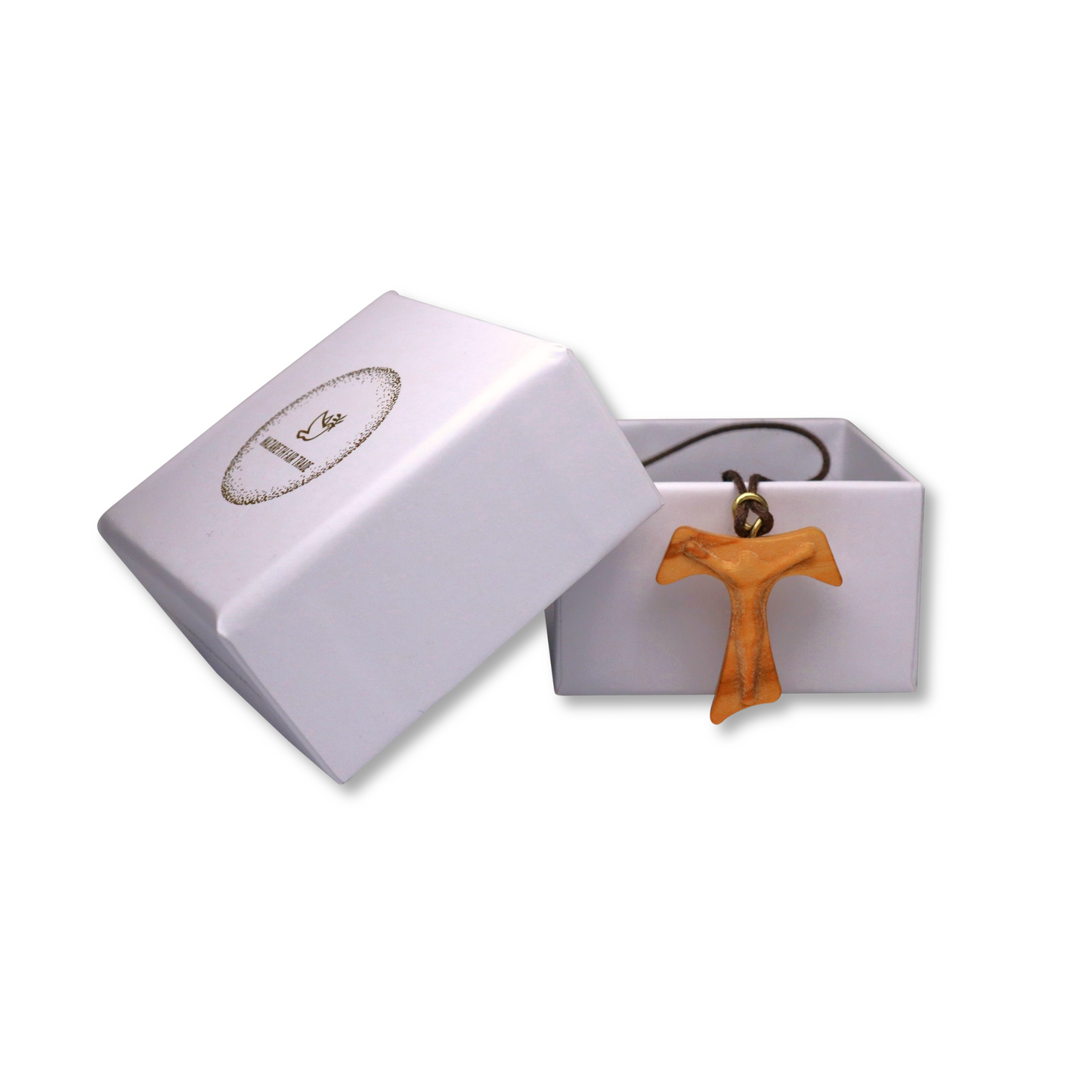 Cross pendant with a cord in a white jewelry box on a white background