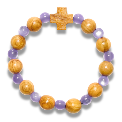 Bracelet with olive wood beads and a cross on a white background
