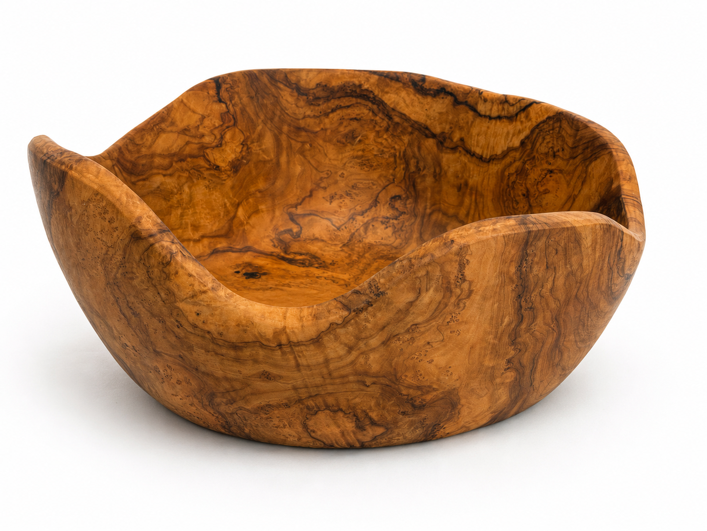 A handcrafted wooden bowl with a rich, wavy grain pattern in warm golden-brown and amber tones, photographed on a clean white background.