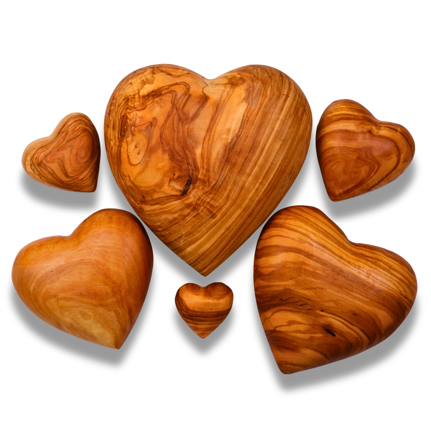 Set of olive wood heart shapes on a white background