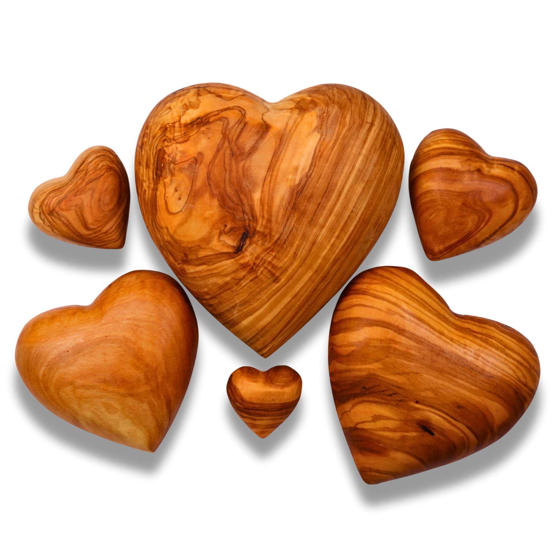 Set of olive wood heart shapes on a white background