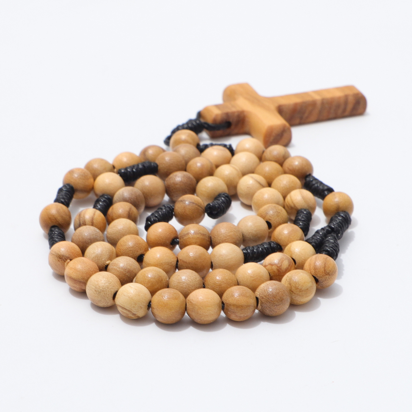 Wooden rosary with cross on a white background