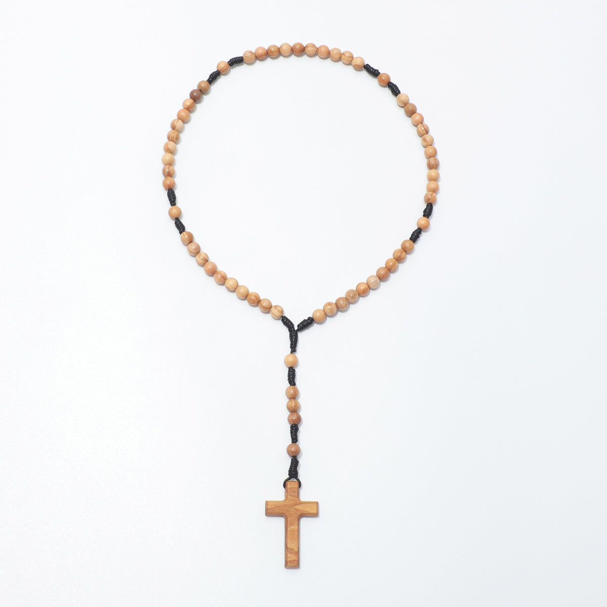 Full view of the olive wood pocket rosary with small round beads, black knotted cord and a plain wooden cross