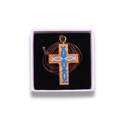 Olive wood cross pendant with blue fish symbols in a gift box