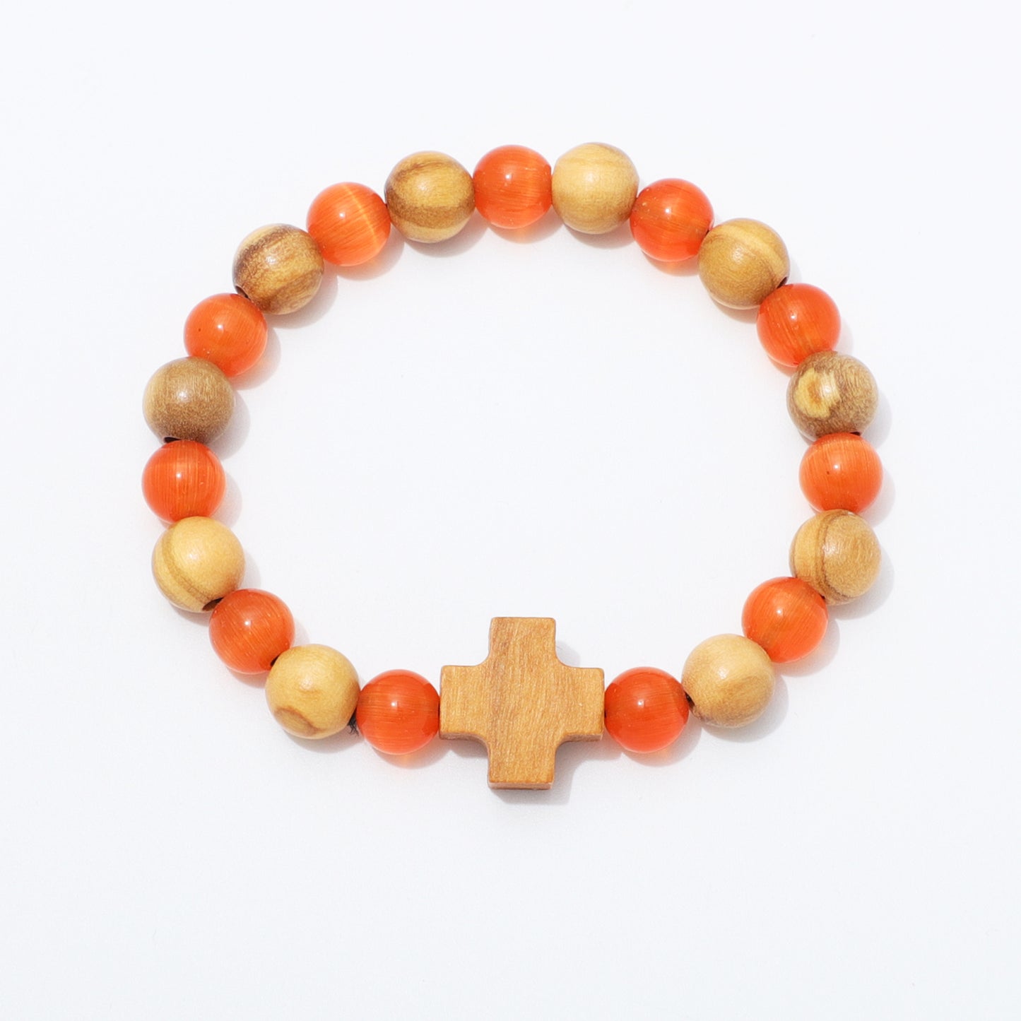 A beaded stretch bracelet featuring alternating orange and light brown wooden beads, with a central light wood cross charm, displayed on a clean white background.