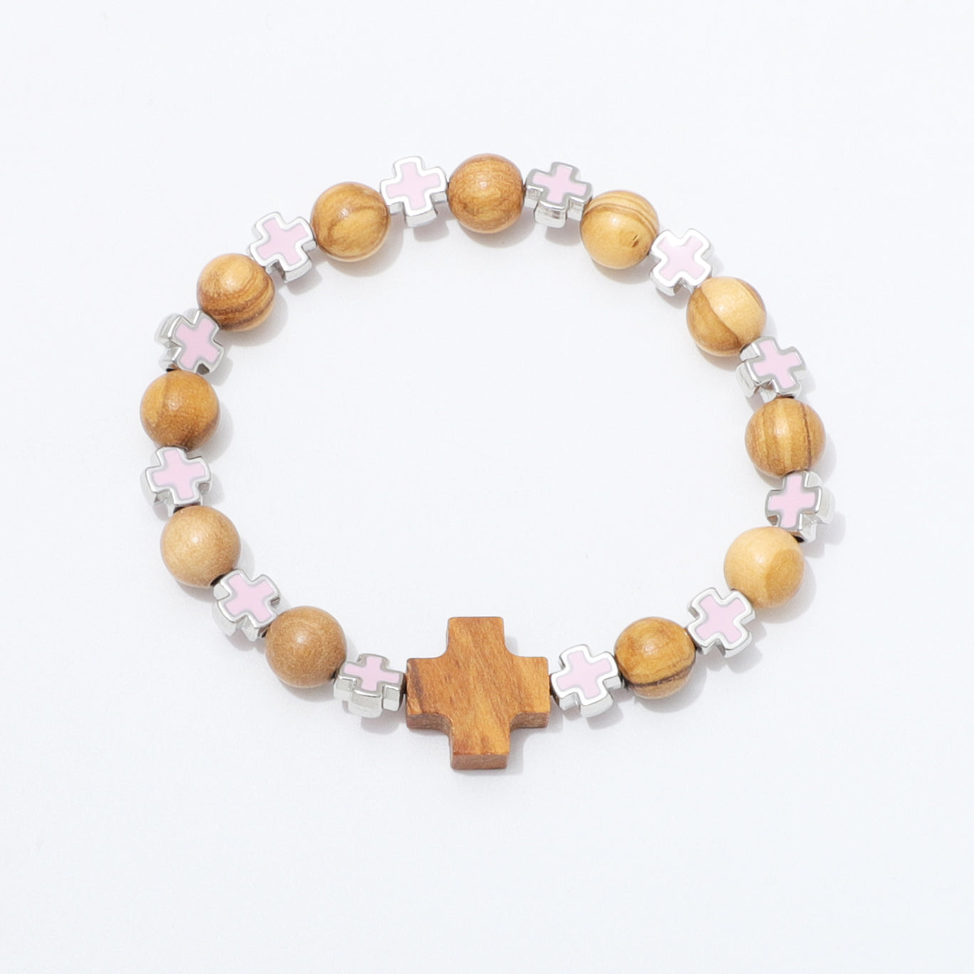 A wooden bead stretch bracelet featuring natural wood beads, silver-toned metal accents, light pink enamel crosses, and a larger central wooden cross, displayed on a clean white background.