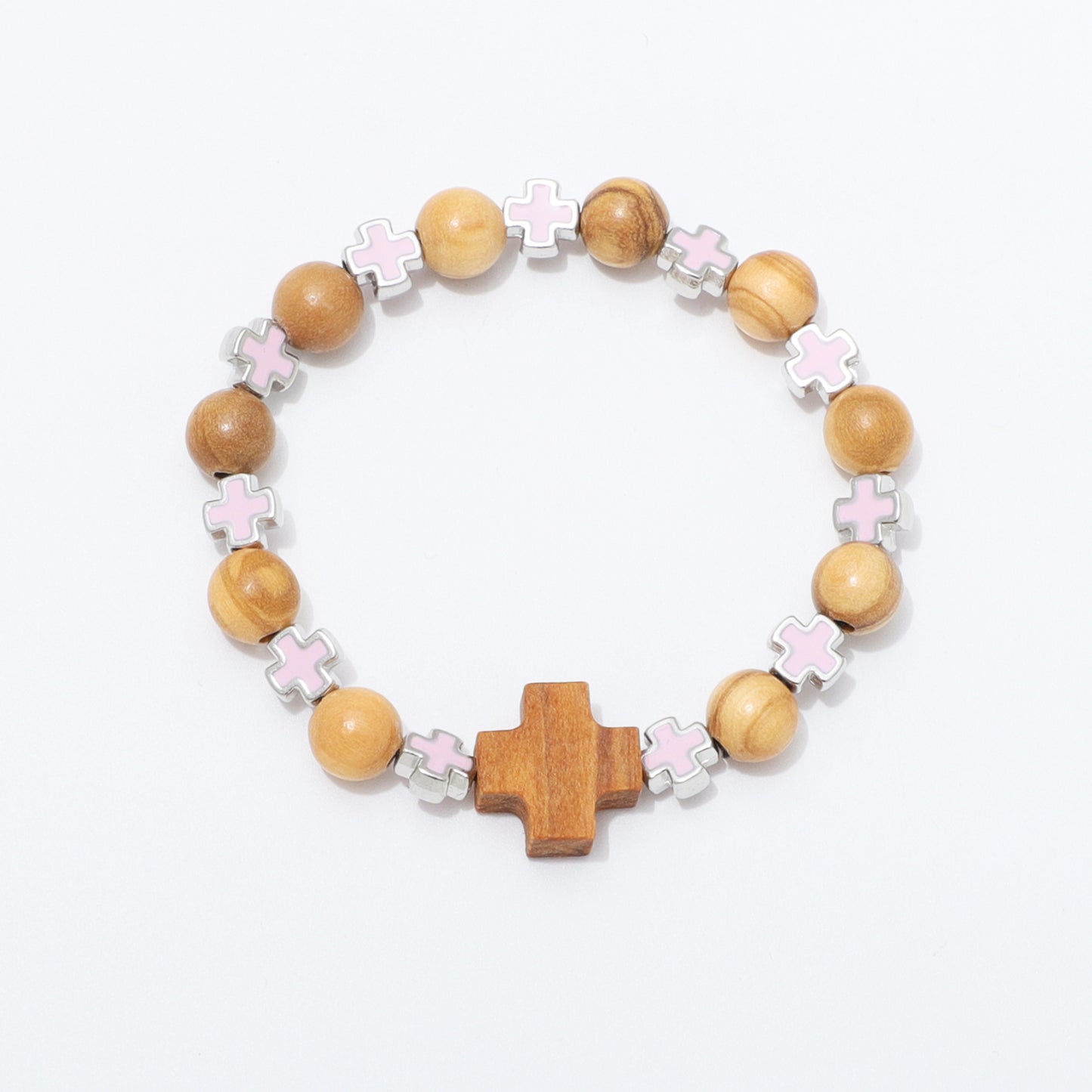 A beaded stretch bracelet featuring light brown wooden beads, silver-toned cross charms with pale pink enamel, and a larger wooden cross centerpiece, displayed on a clean white background.