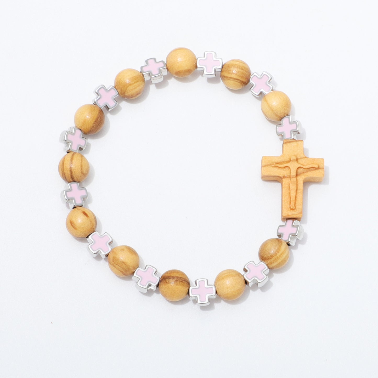A wooden bead bracelet featuring natural wood beads, light pink enamel cross charms, silver-toned spacer details, and a carved wooden cross pendant, displayed on a clean white background.